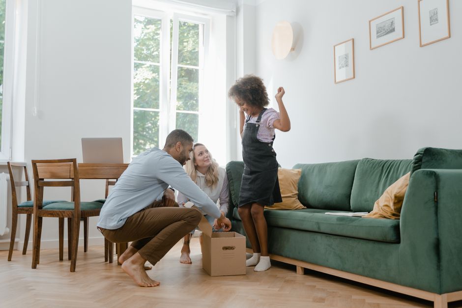 Family happily unpacking in their new out-of-state home